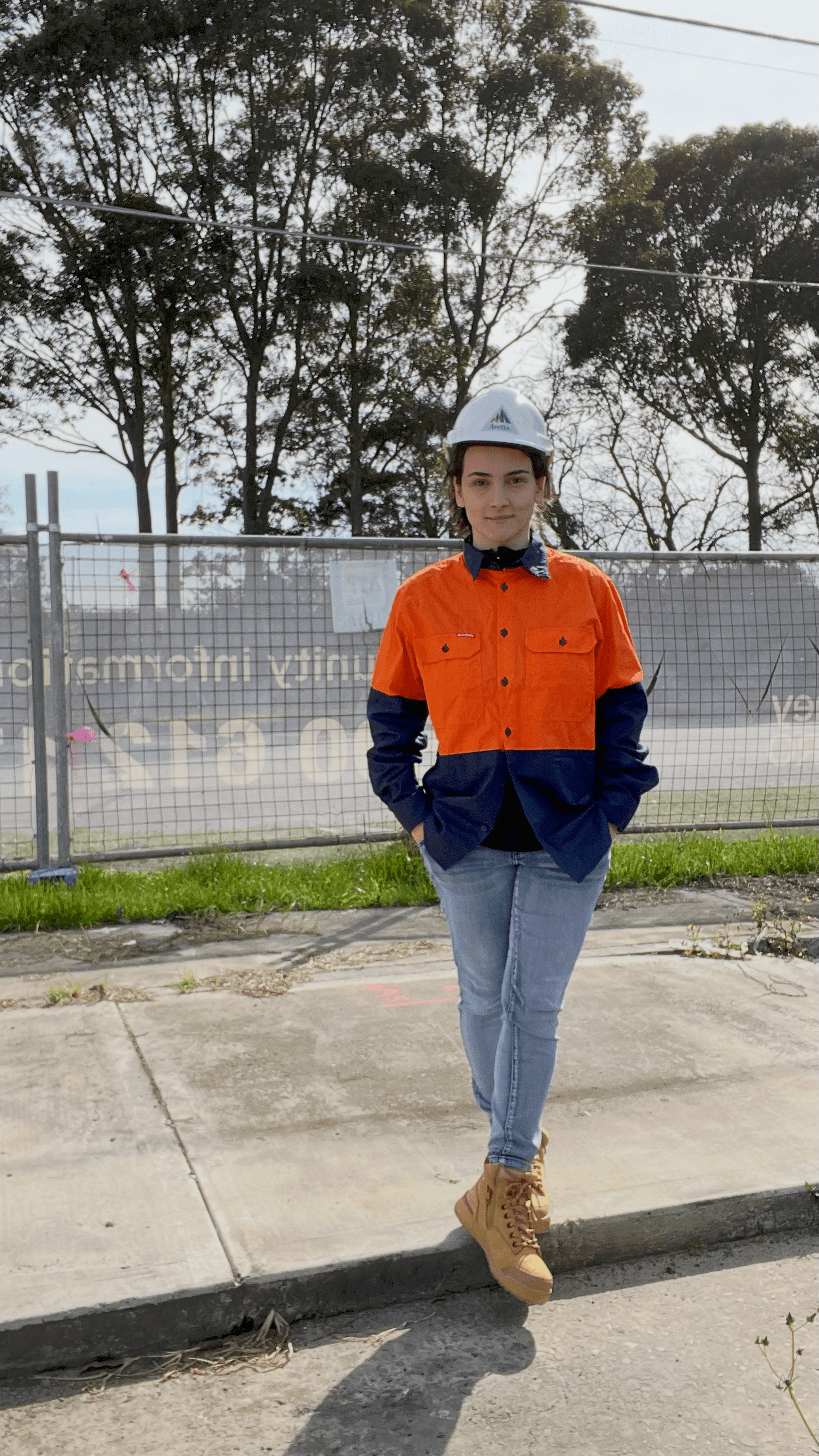 Sara on site visit in hard hat