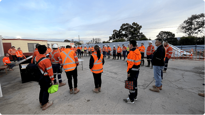 Workers at dawn briefing